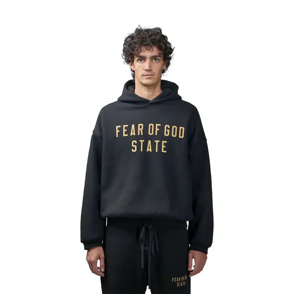 FearofGodEssentialsFleeceHoodieBlack_FW24_-ModelFront.webp